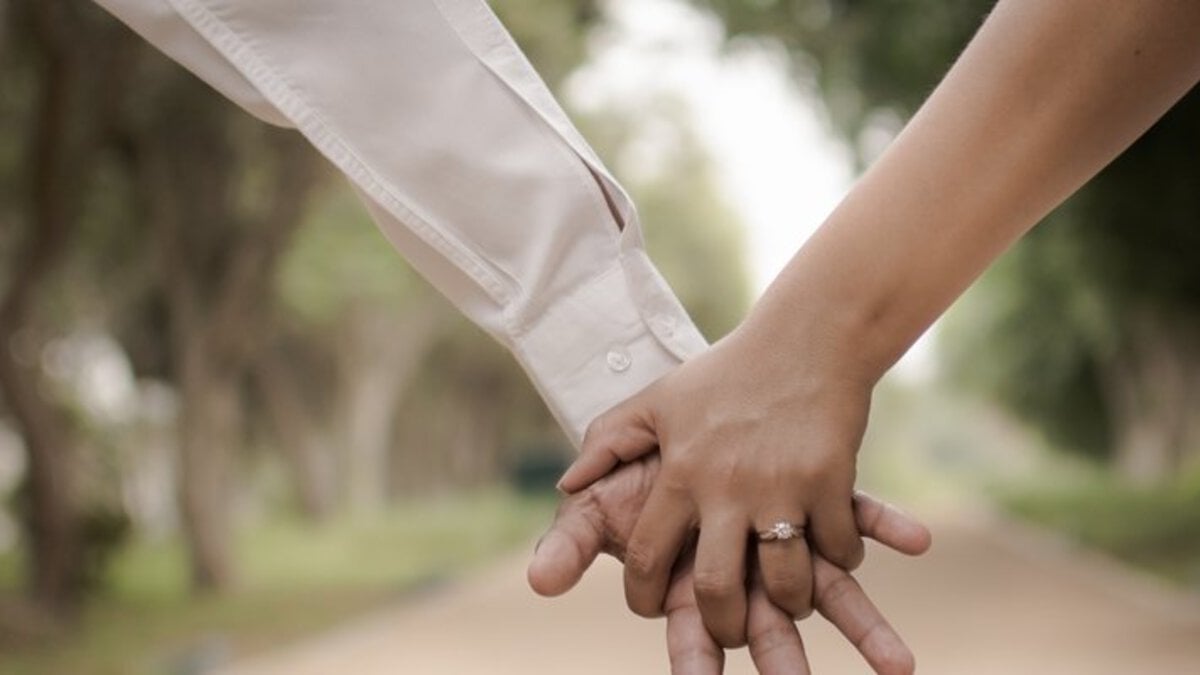 Holding hands with wedding ring after meeting on Affair Alert