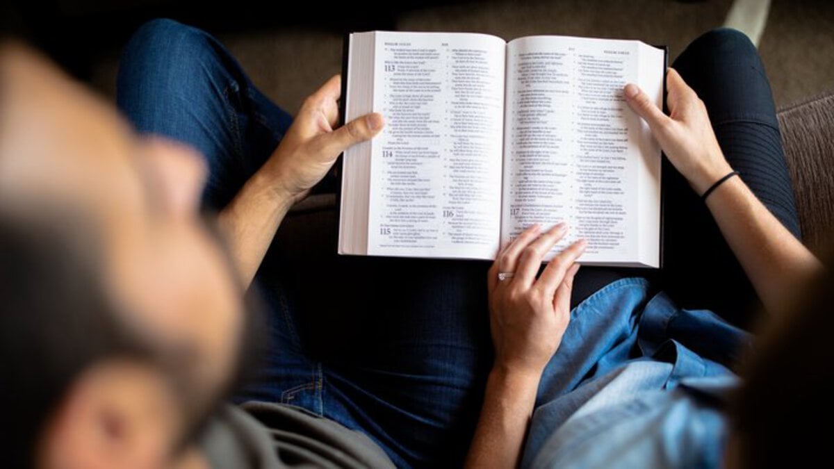 christian dating couple reading a bible together
